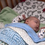Me asleep in my new cot